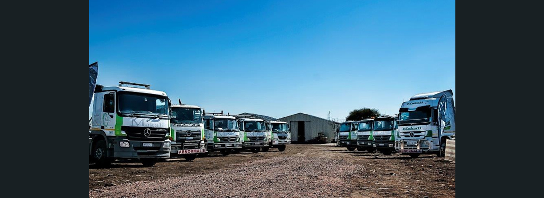 fleet of makali branded trucks